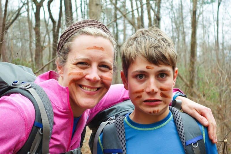 Aidan and Nancy with mud paint