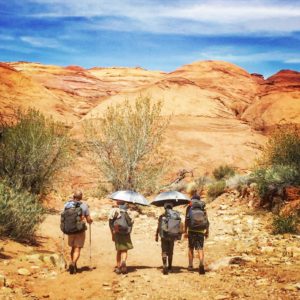 Kids carrying Gossamer Gear umbrellas