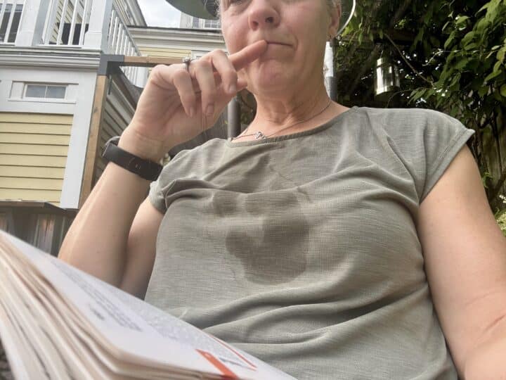 sweaty shirt on a woman at a restaurant