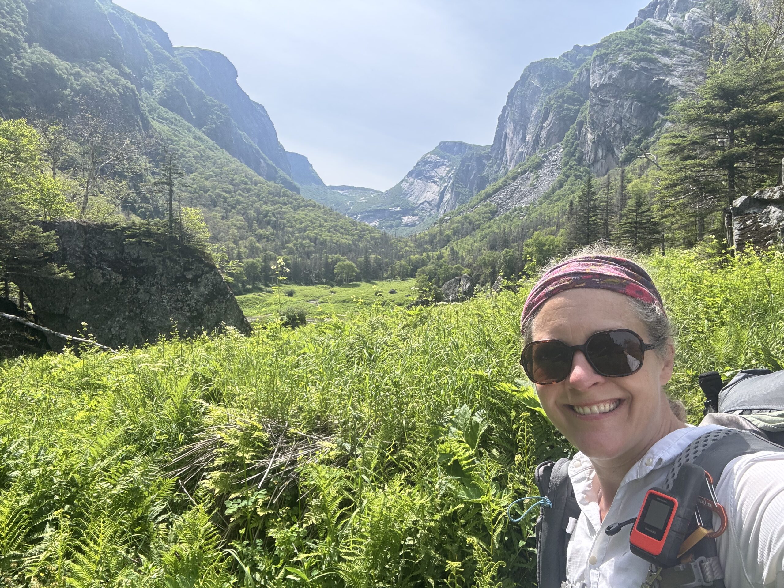 woman in front of ferns